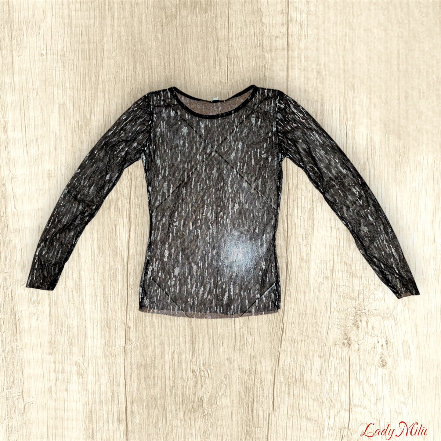 Maglia trasparente nera e e oro con canotta nera