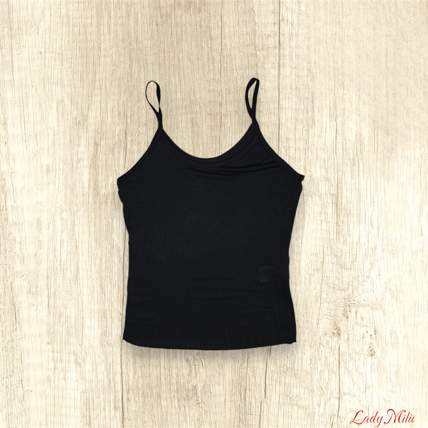Maglia trasparente nera e e oro con canotta nera