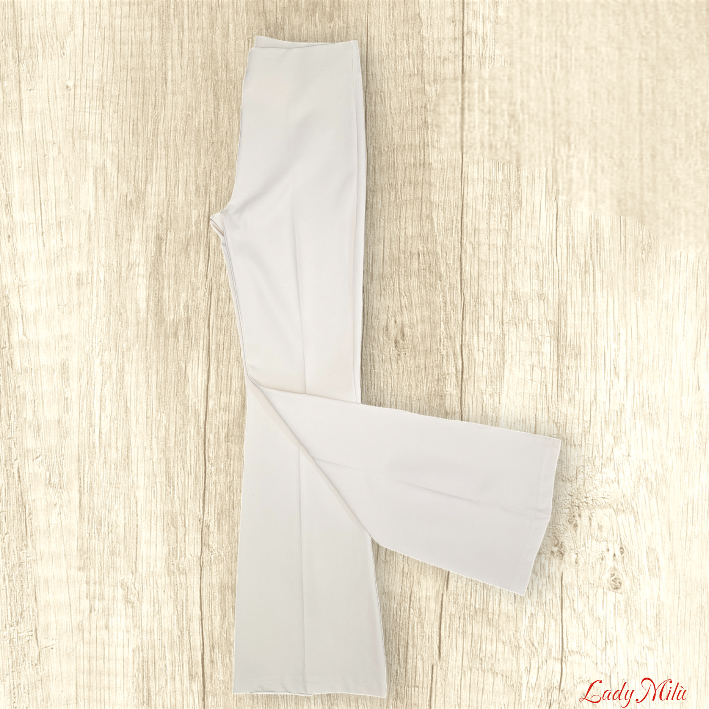 Pantalone zampa crema