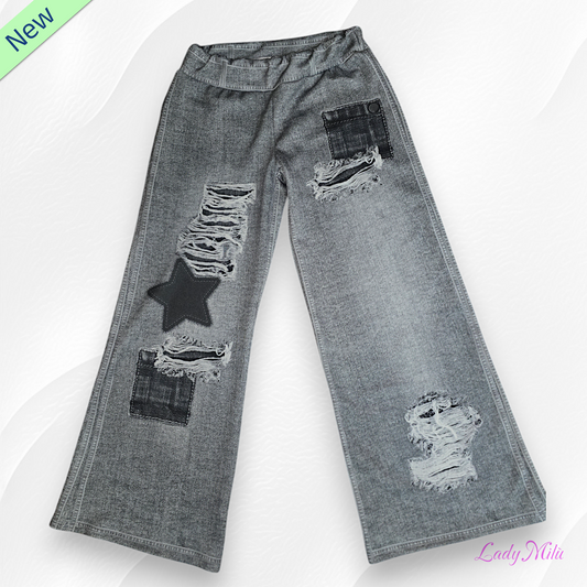Pantalone effetto jeans nero elasticizzato gamba larga