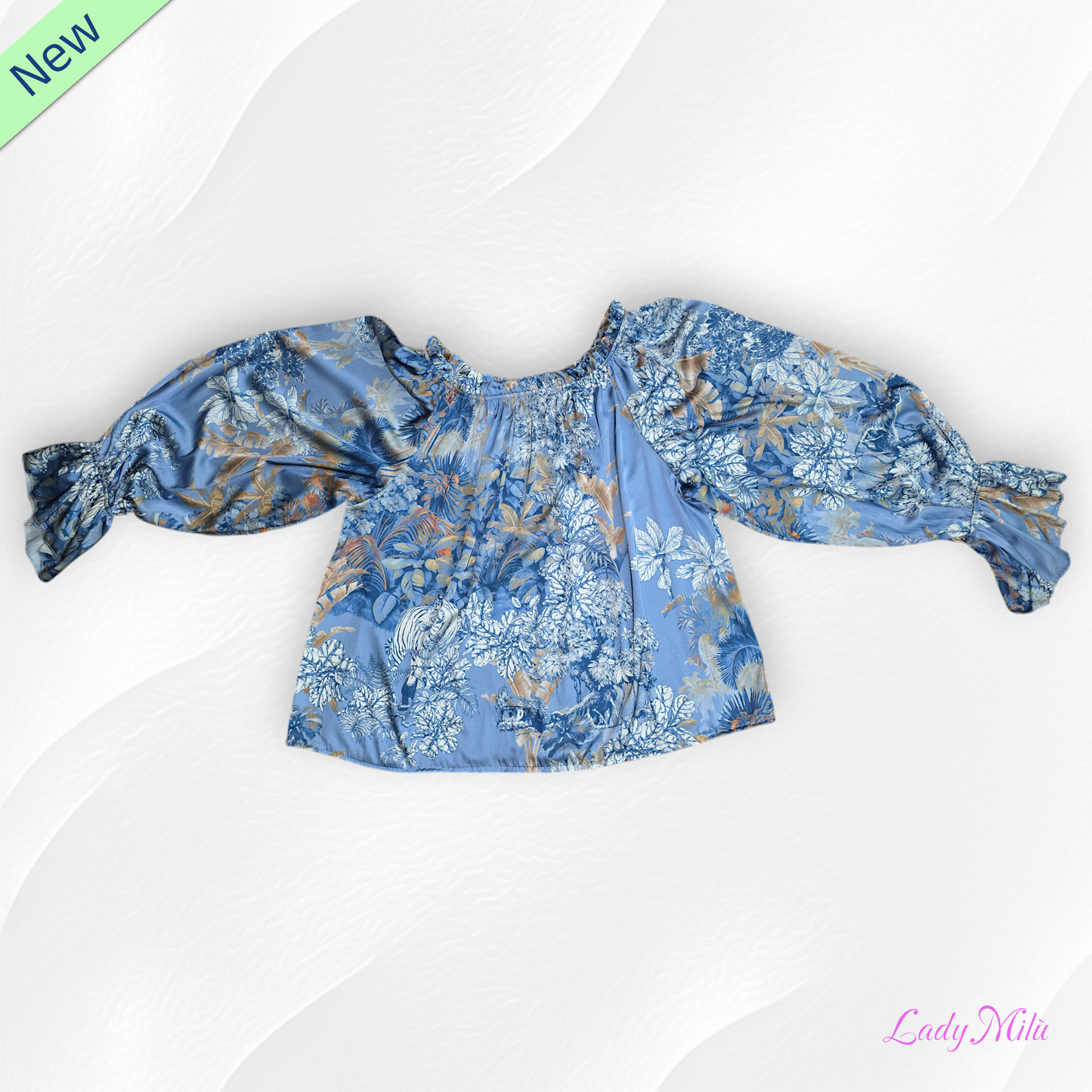 Blusa azzurra e  beige  con fiori