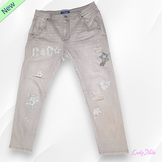 Jeans chiaro con strass e perline